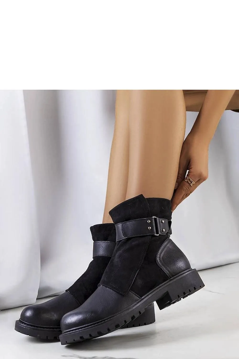 Black ankle boots with a strap
