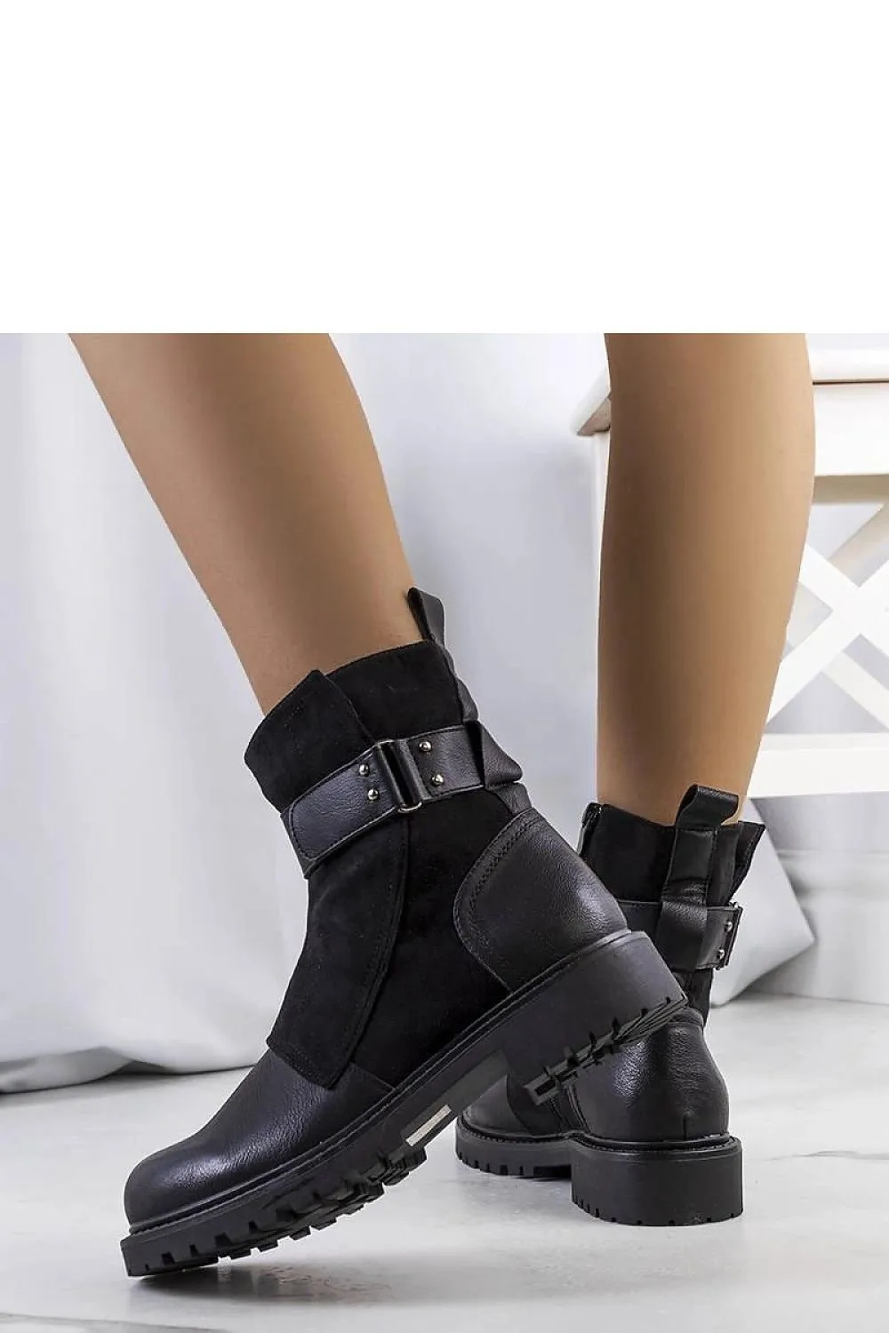 Black ankle boots with a strap