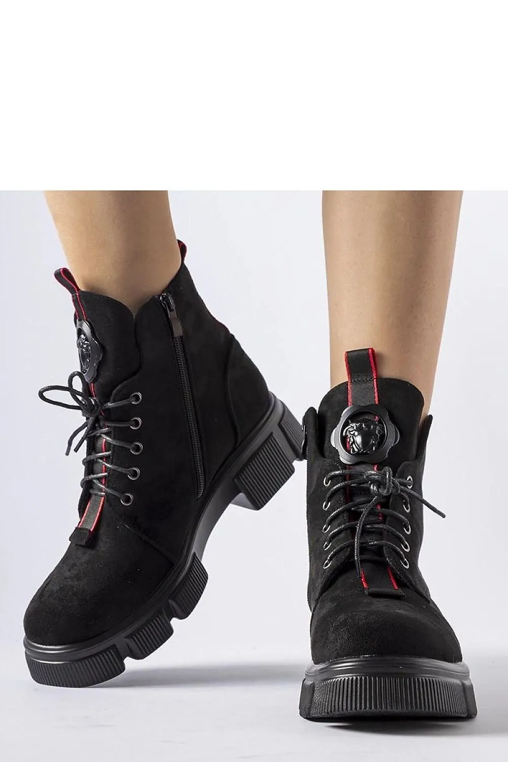 Black boots decorated with red trim