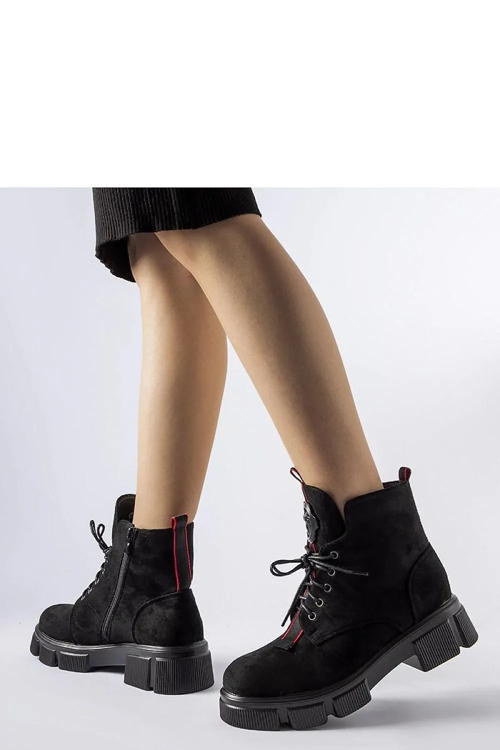 Black boots decorated with red trim
