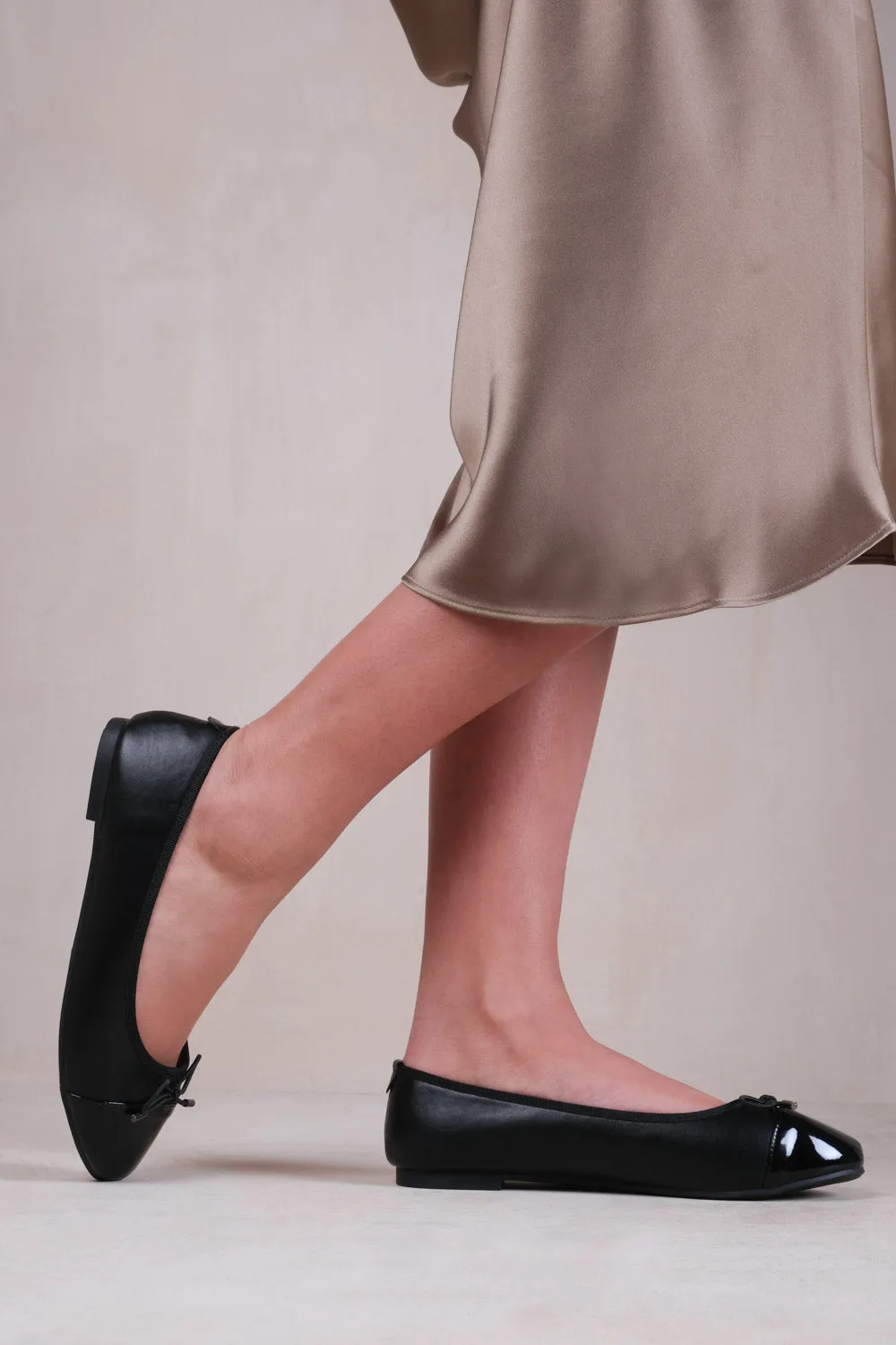 JANICE BALLERINA FLATS WITH FRON BOW DETAIL IN BLACK FAUX LEATHER